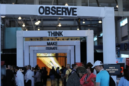 Hallway with large signs: observe, think, make, iterate