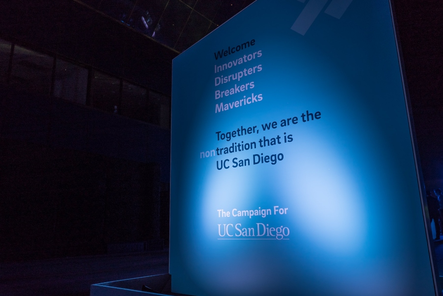 A lit-up Design Lab banner at the Chancellor’s Campaign with the text, ‘Welcome Innovators Disruptors Breakers Mavericks. Together, we are the nontradition that is UC San Diego. The Campaign for UC San Diego.’